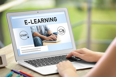 Image of Woman using laptop for online studying outdoors, closeup. Adult education 