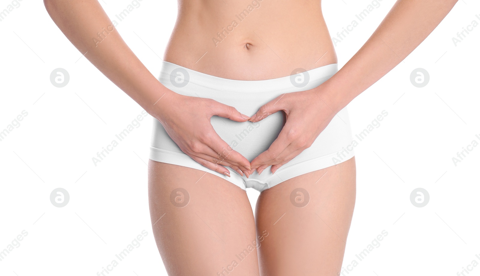 Photo of Young woman making heart symbol with hands near underwear on white background. Gynecology