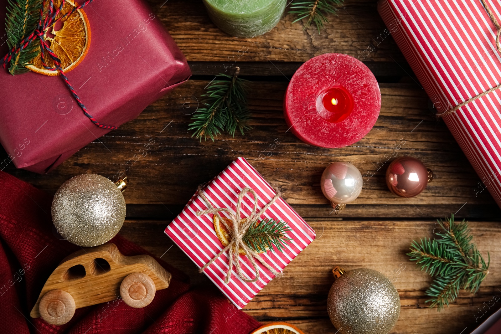 Photo of Flat lay composition with beautifully wrapped gift boxes on wooden table