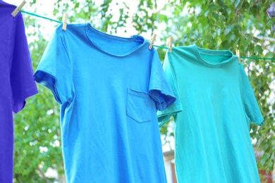 Photo of Clothes on laundry line outdoors on sunny day