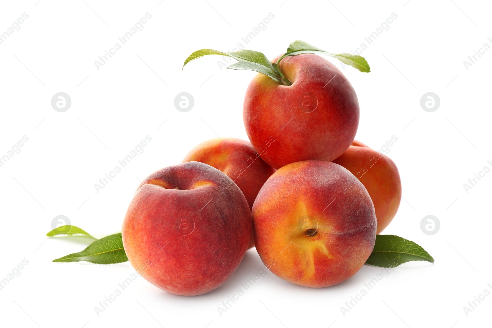 Photo of Delicious ripe juicy peaches with leaves isolated on white