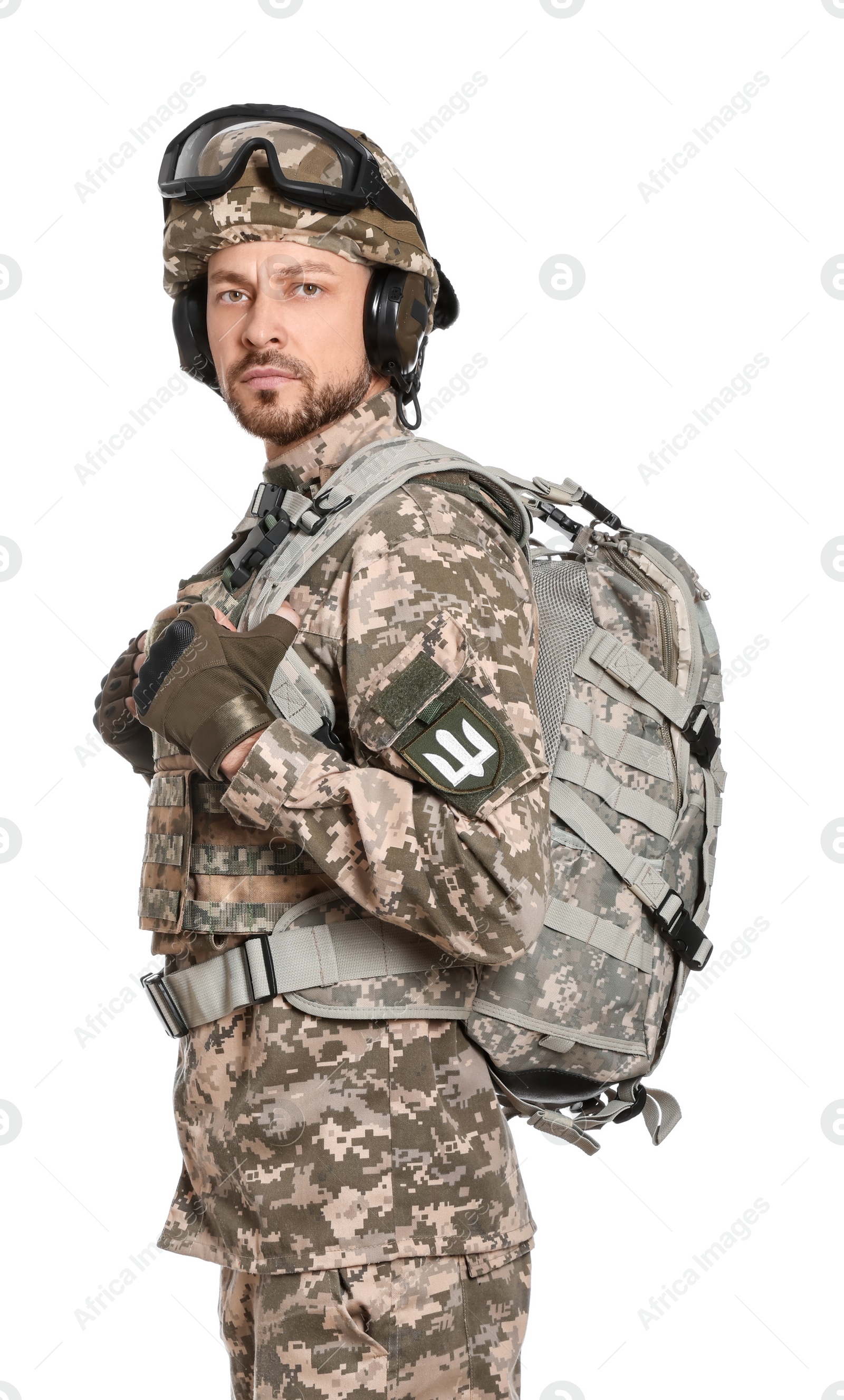 Photo of Soldier in Ukrainian military uniform with tactical goggles and backpack on white background