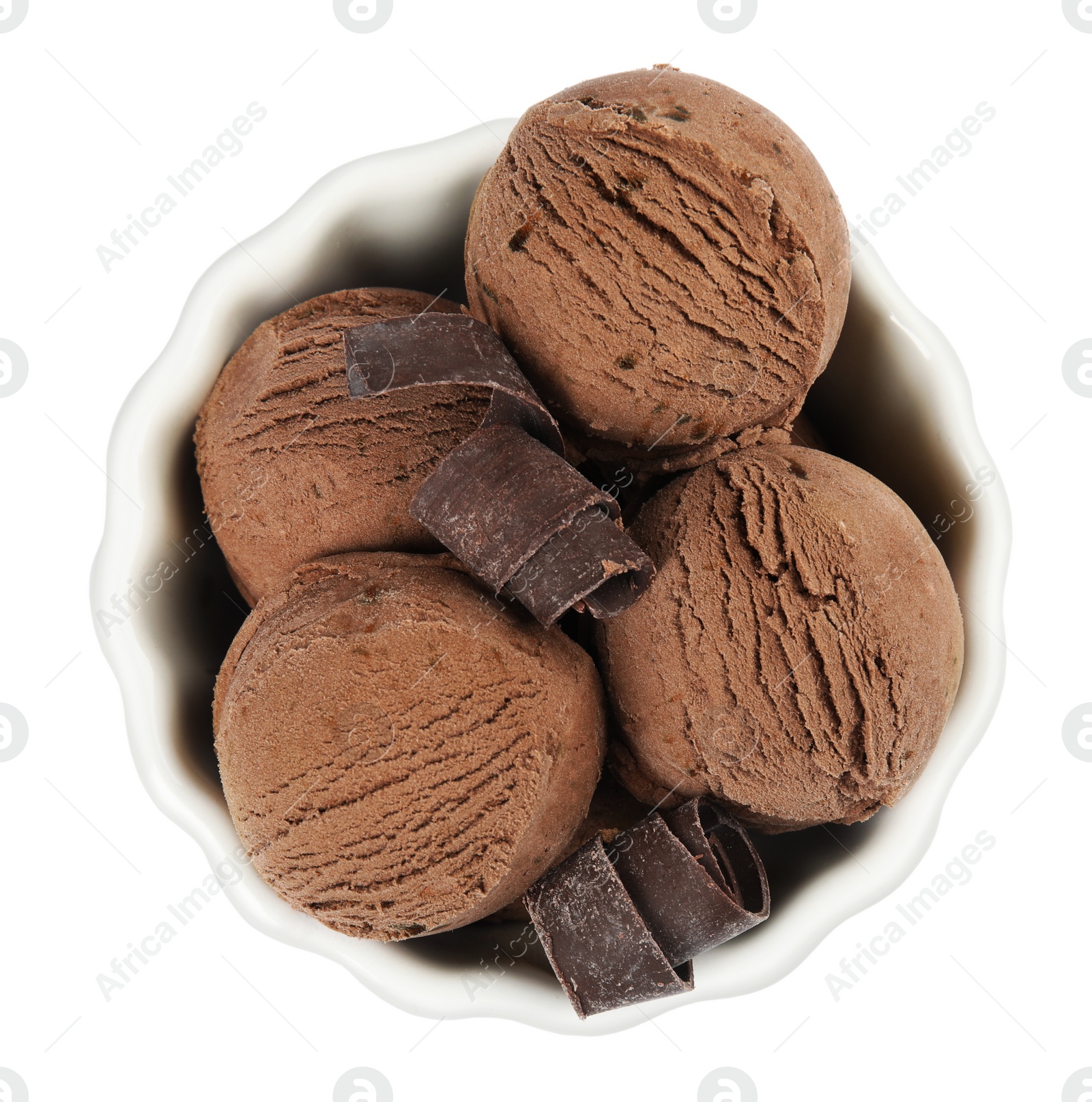 Photo of Bowl of tasty ice cream with chocolate curls isolated on white, top view