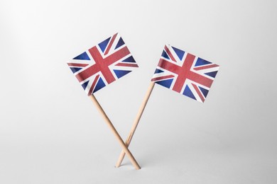 Photo of Small paper flags of United Kingdom on light background