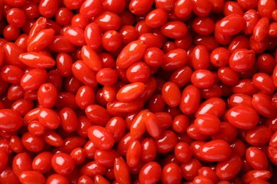 Photo of Fresh ripe goji berries as background, top view