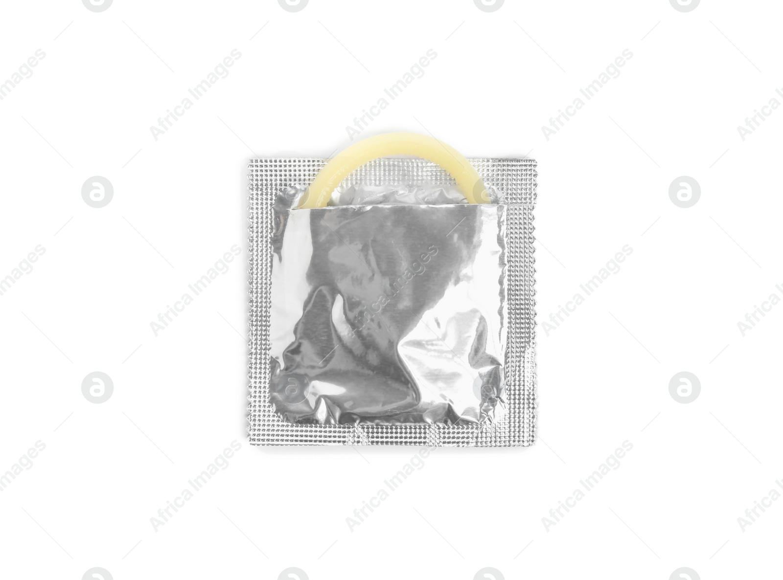 Photo of Torn condom package isolated on white, top view. Safe sex