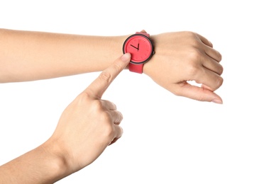 Woman pointing at her watch on white background, closeup. Time management