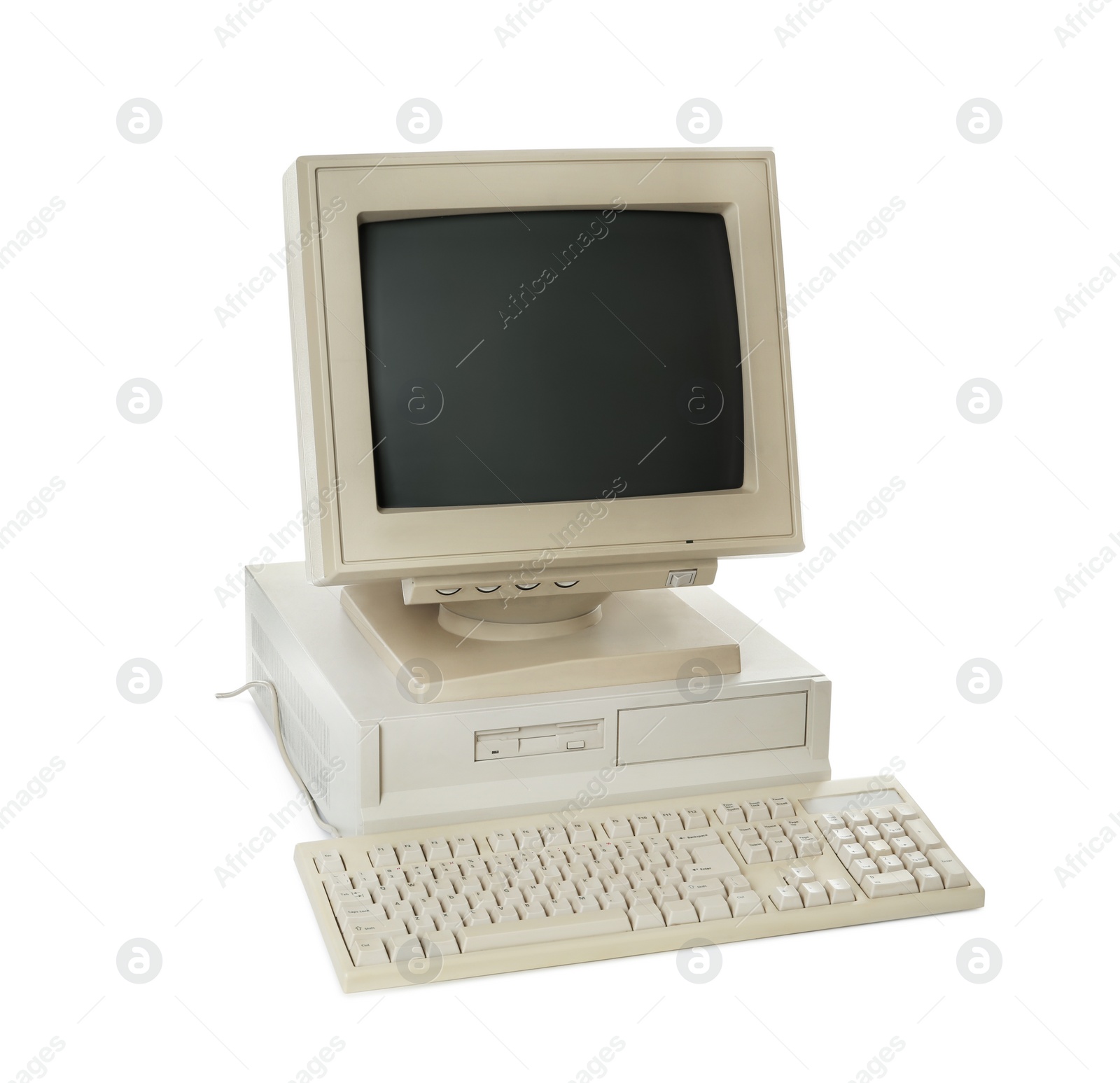 Photo of Old computer monitor, system unit and keyboard on white background