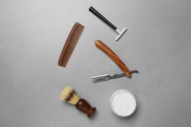 Photo of Set of men's shaving tools on light gray table, flat lay