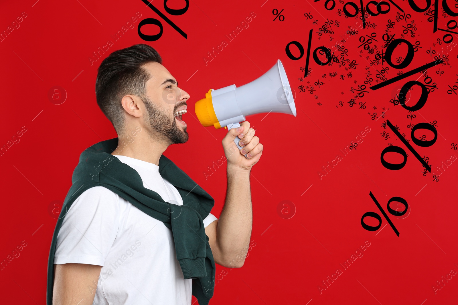 Image of Discount offer. Man shouting into megaphone on red background. Percent signs coming out from device