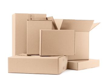 Photo of Pile of cardboard boxes on white background