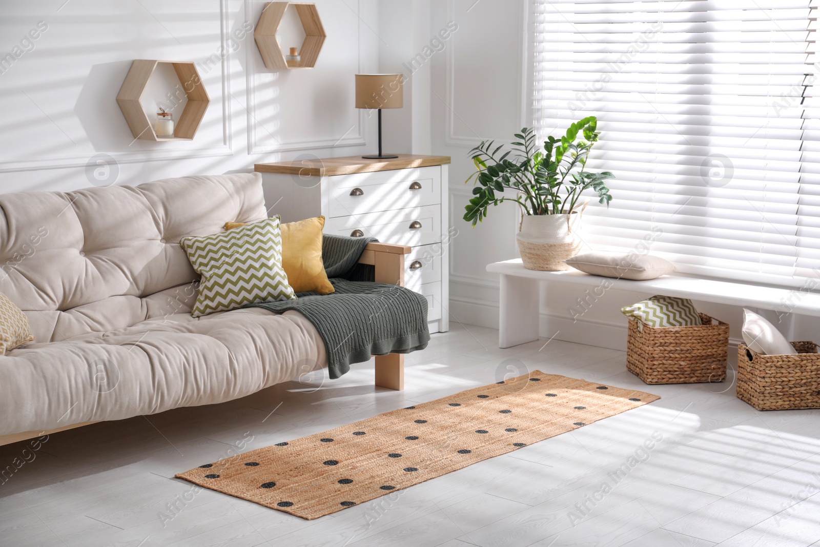 Photo of Stylish rug with dots on floor in living room