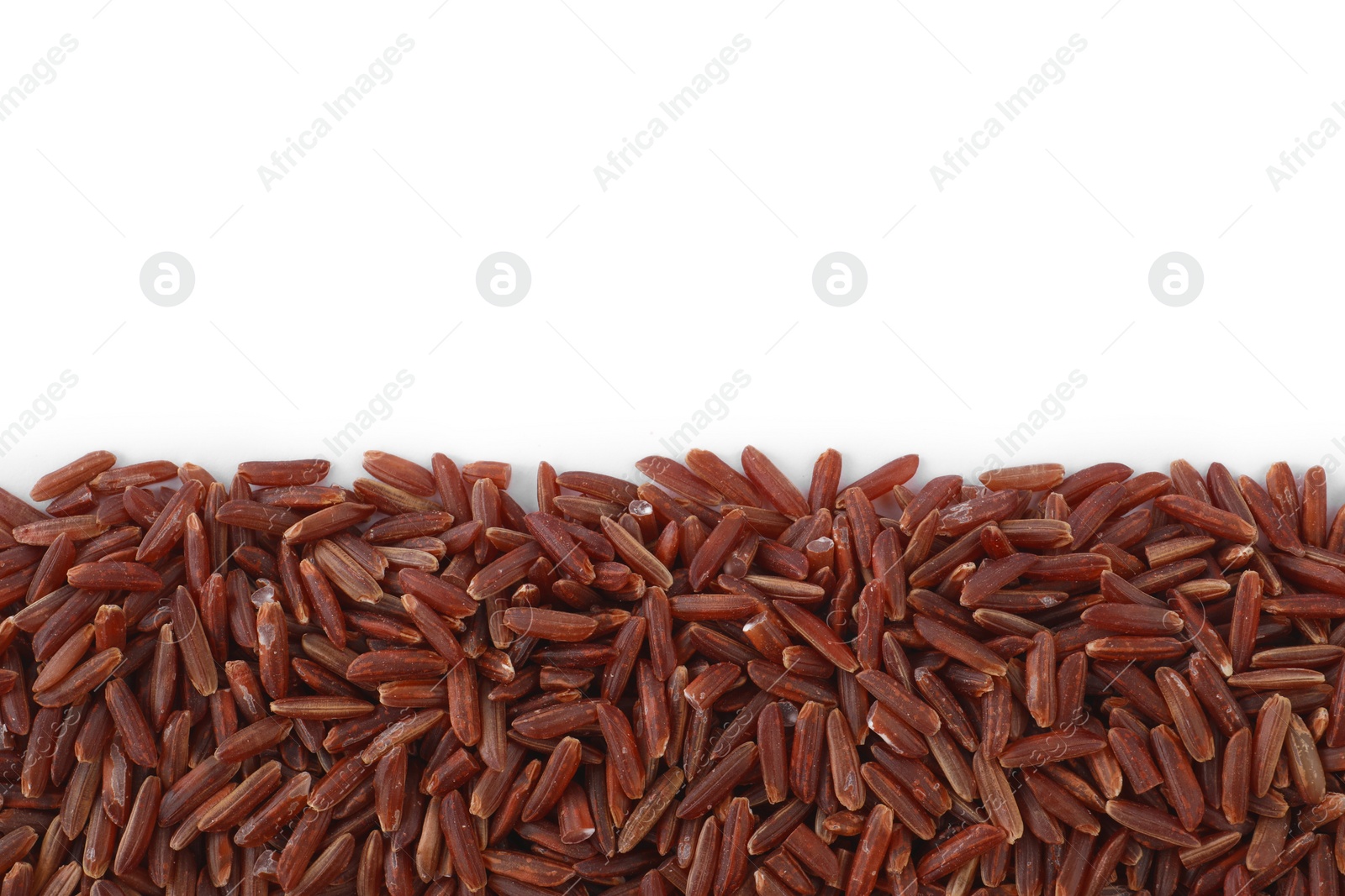 Photo of Raw red rice isolated on white, top view