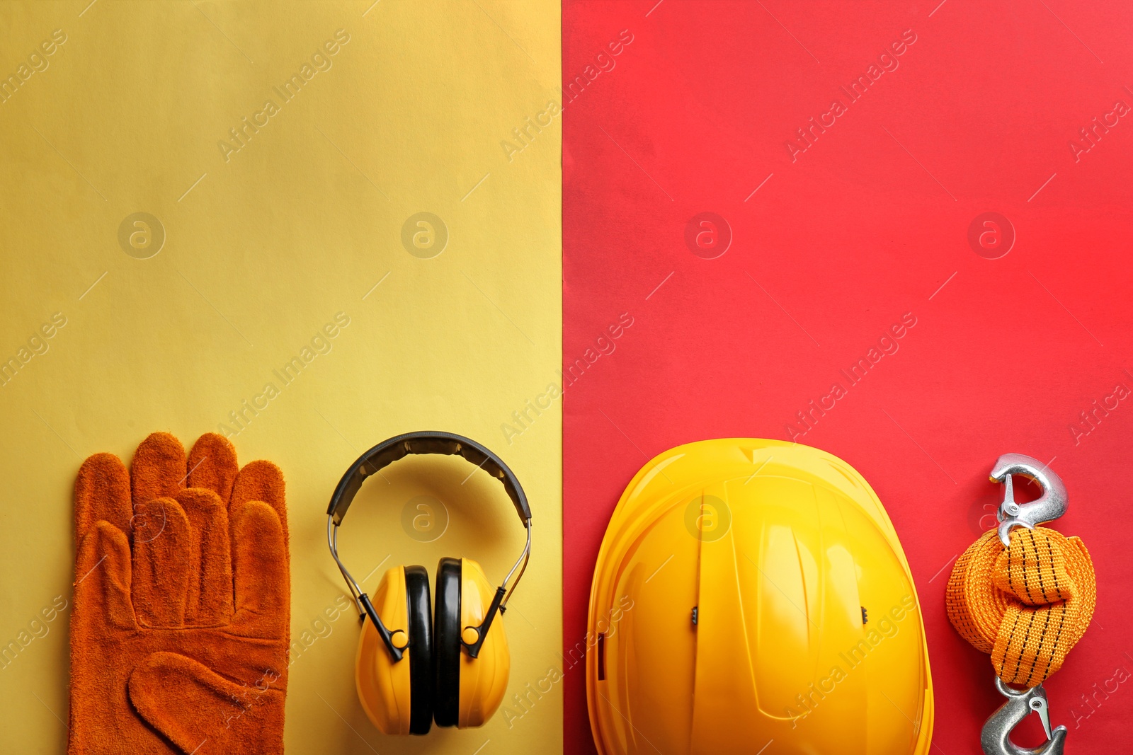 Photo of Flat lay composition with safety equipment and space for text on color background