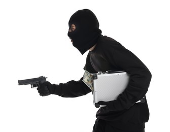 Photo of Thief in balaclava with gun and briefcase of money on white background