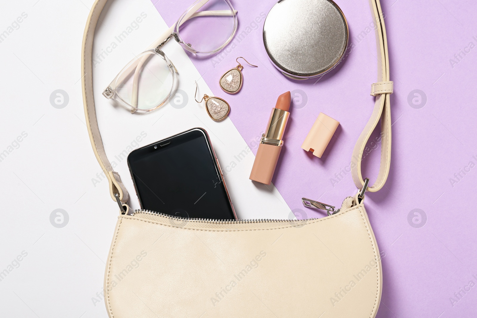 Photo of Stylish women's bag and different stuff on color background, flat lay