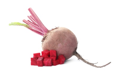 Whole and cut red beets on white background