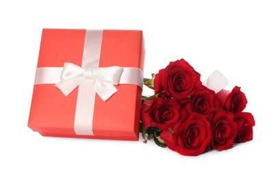 Photo of Beautiful red roses and gift box on white background. St. Valentine's day celebration