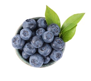Photo of Fresh ripe blueberries and leaves in bowl isolated on white, top view