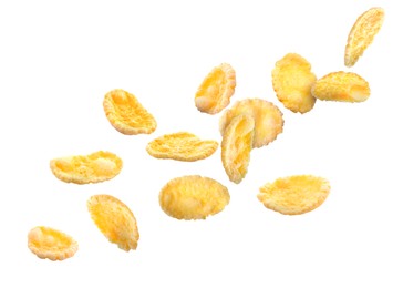 Golden corn flakes falling on white background