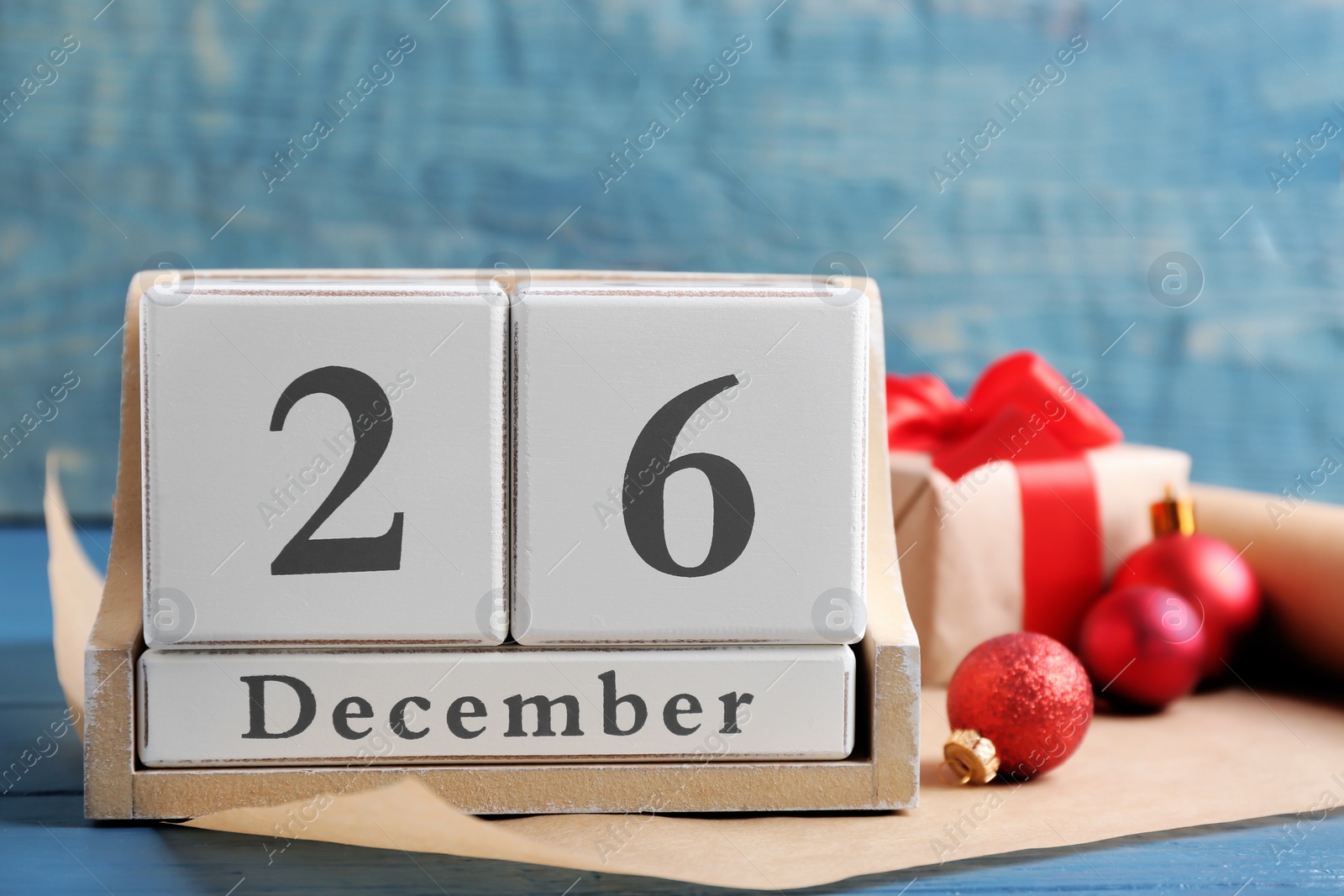 Photo of Wooden block calendar and decor on table. Christmas countdown