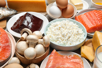 Fresh products rich in vitamin D on table, closeup
