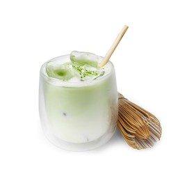Glass of tasty iced matcha latte and bamboo whisk isolated on white