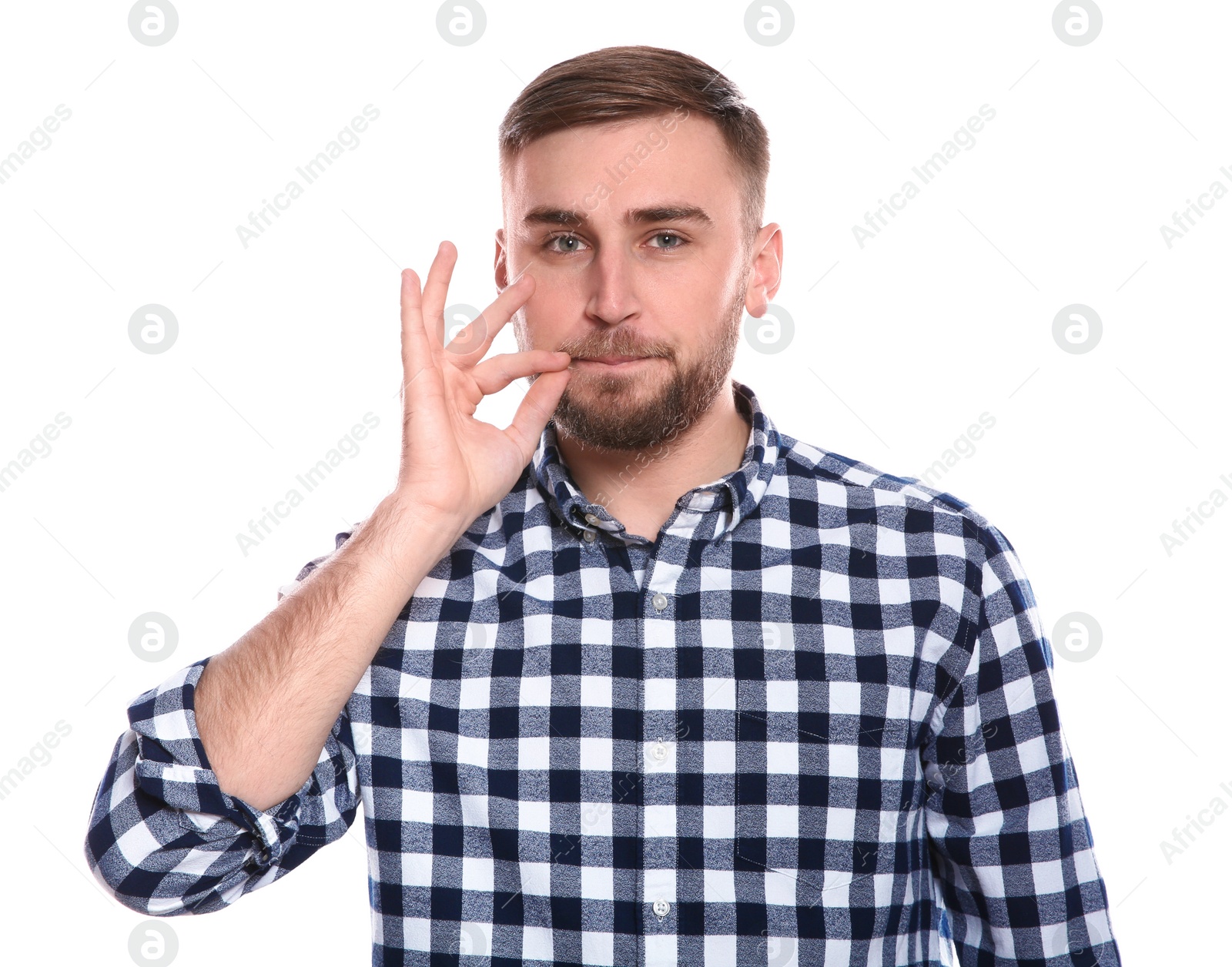 Photo of Man zipping his mouth on white background. Using sign language