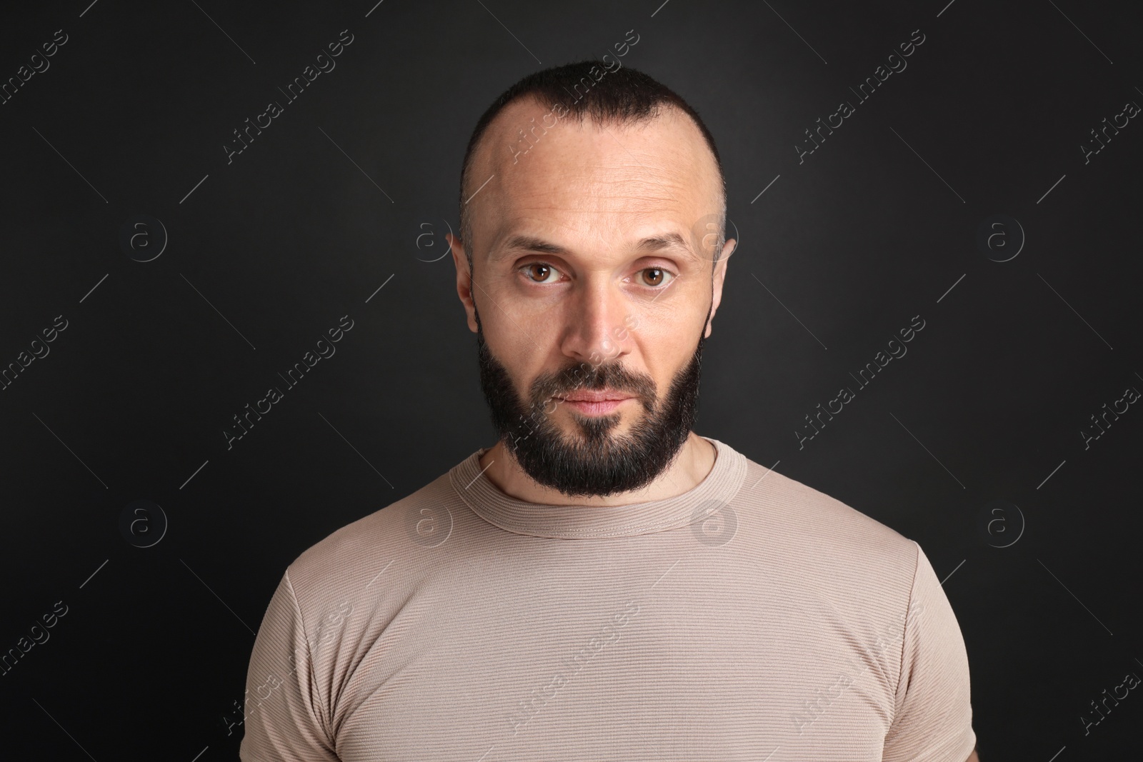 Photo of Portrait of handsome man on black background