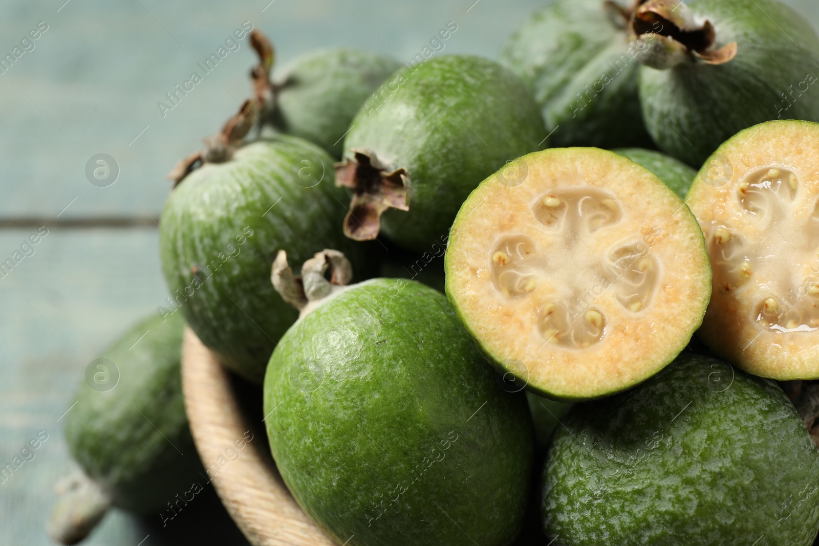 Photo of Fresh green feijoa fruits in bowl, closeup