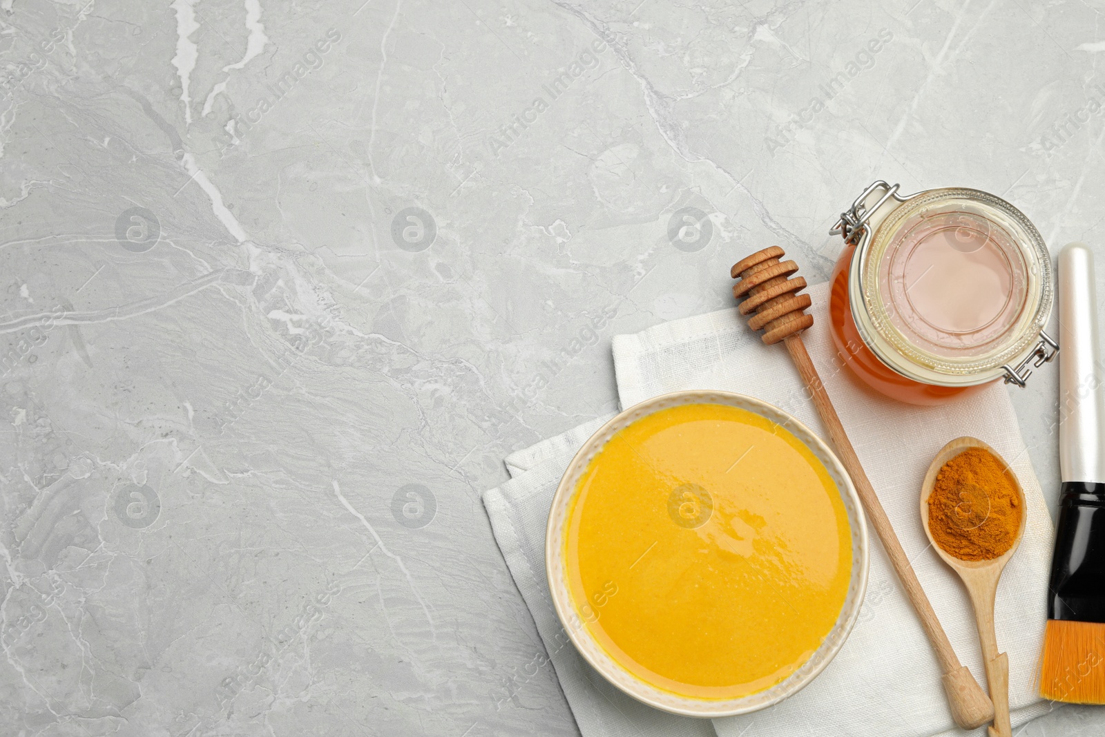 Photo of Different ingredients and handmade face mask on grey marble background, flat lay. Space for text