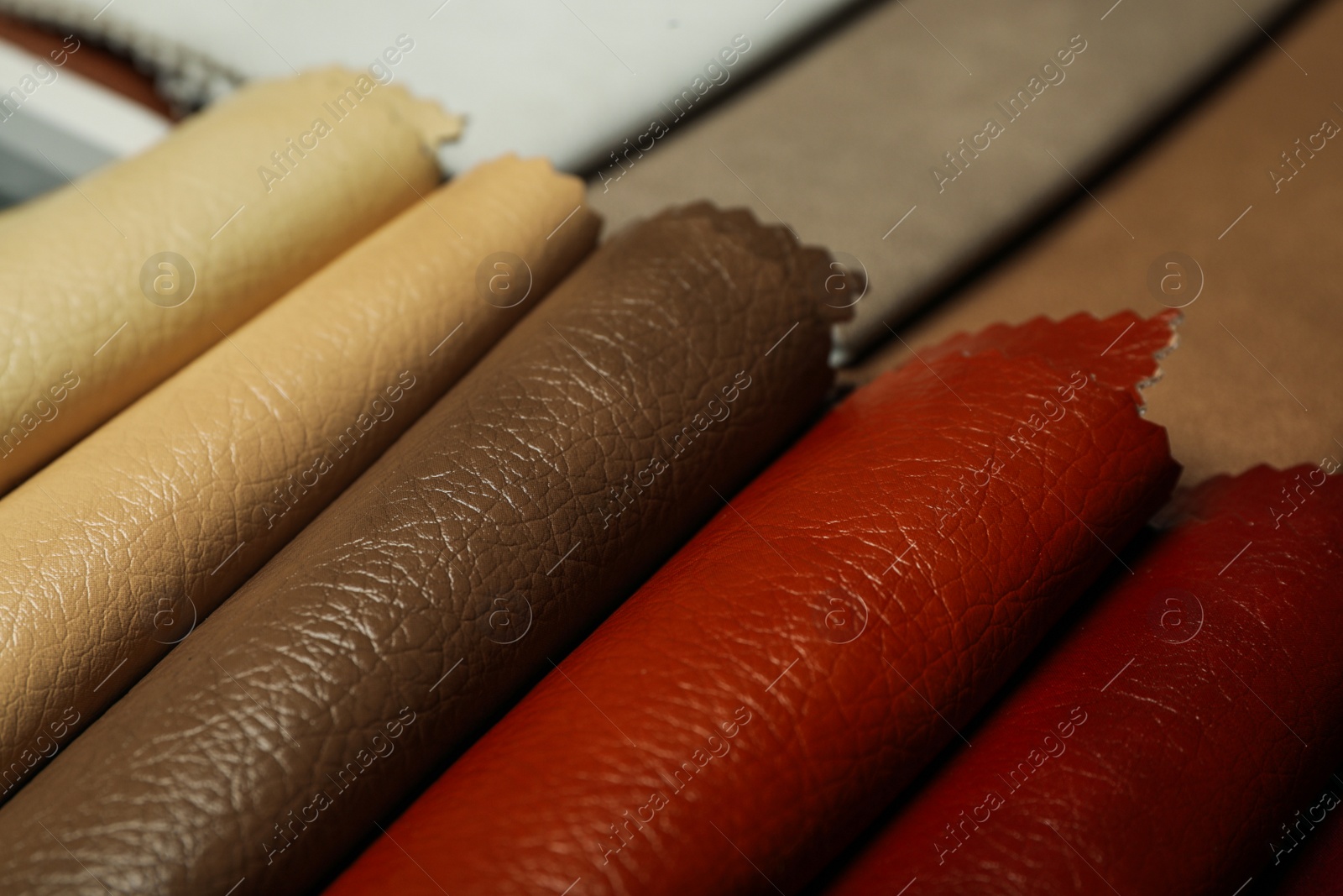 Photo of Different leather samples as background, closeup view