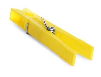 Photo of Bright yellow plastic clothespin isolated on white