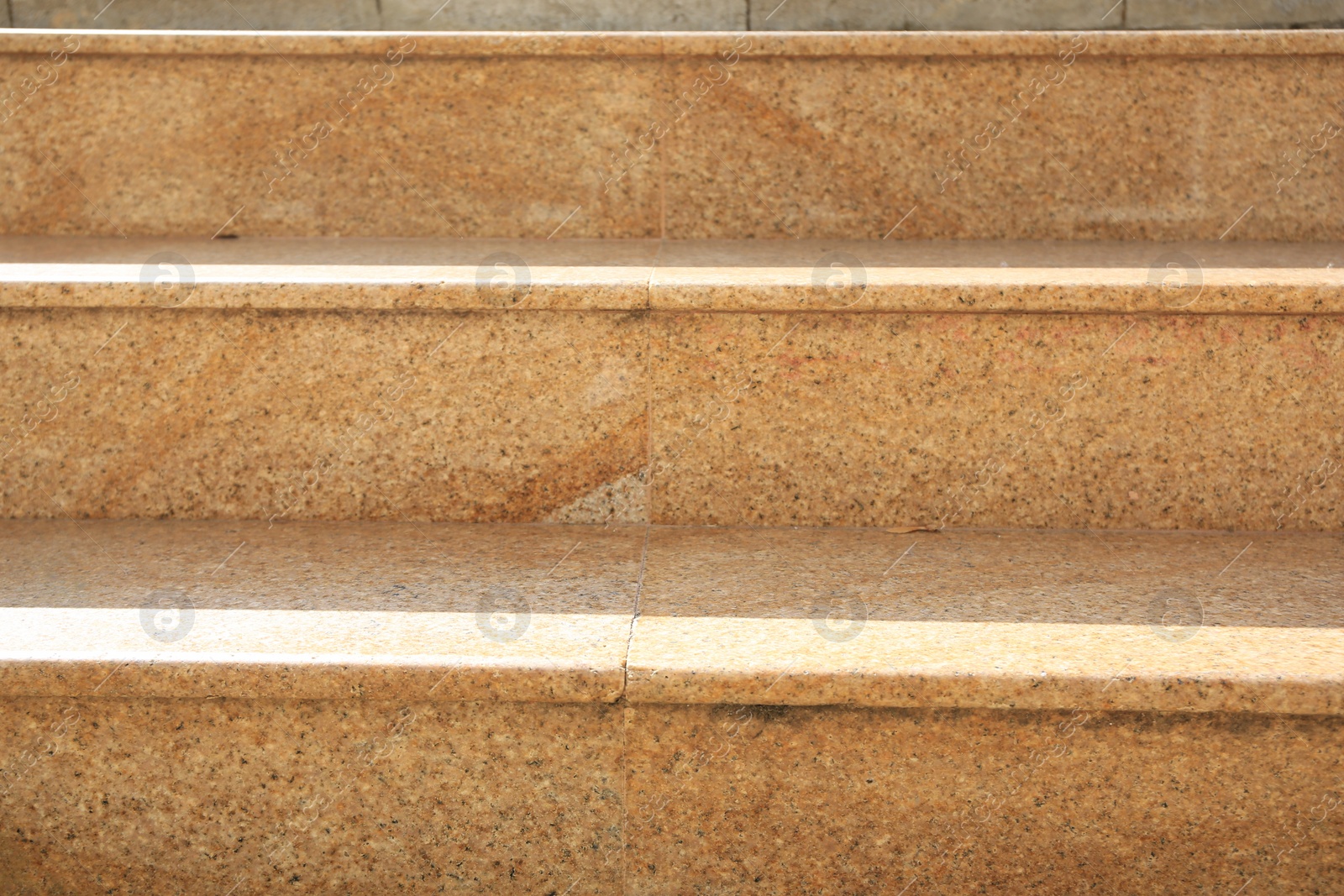 Photo of Closeup view of beige stairs outdoors on sunny day