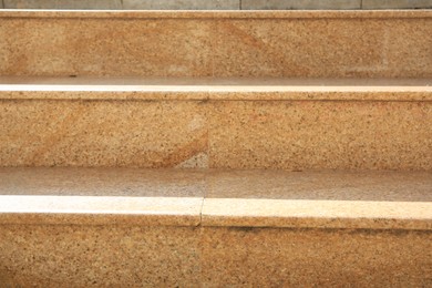 Photo of Closeup view of beige stairs outdoors on sunny day