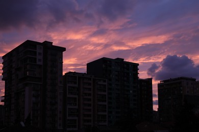 Photo of Beautiful sky with clouds over city in evening