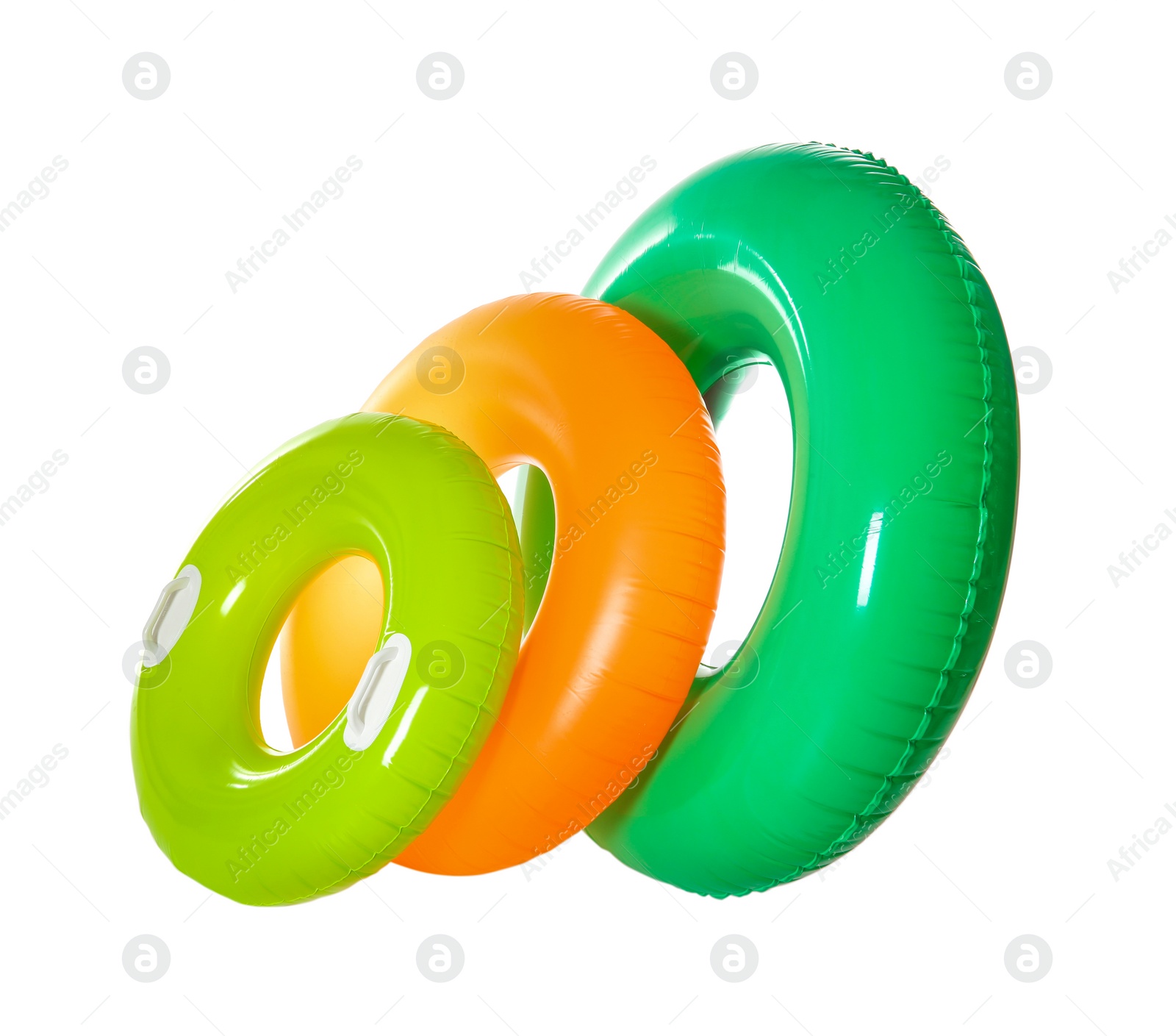 Photo of Different inflatable rings on white background. Summer holidays