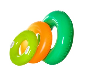 Photo of Different inflatable rings on white background. Summer holidays