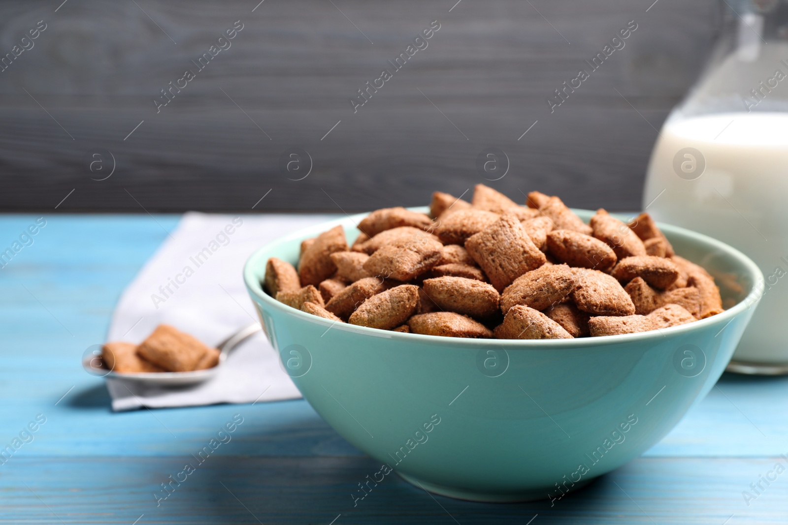 Photo of Delicious chocolate corn pads on light blue wooden table