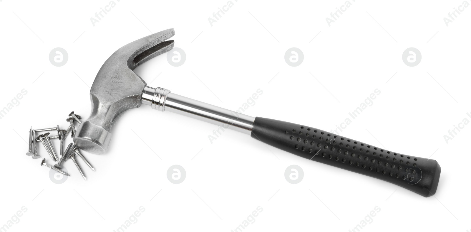 Photo of Hammer and metal nails isolated on white