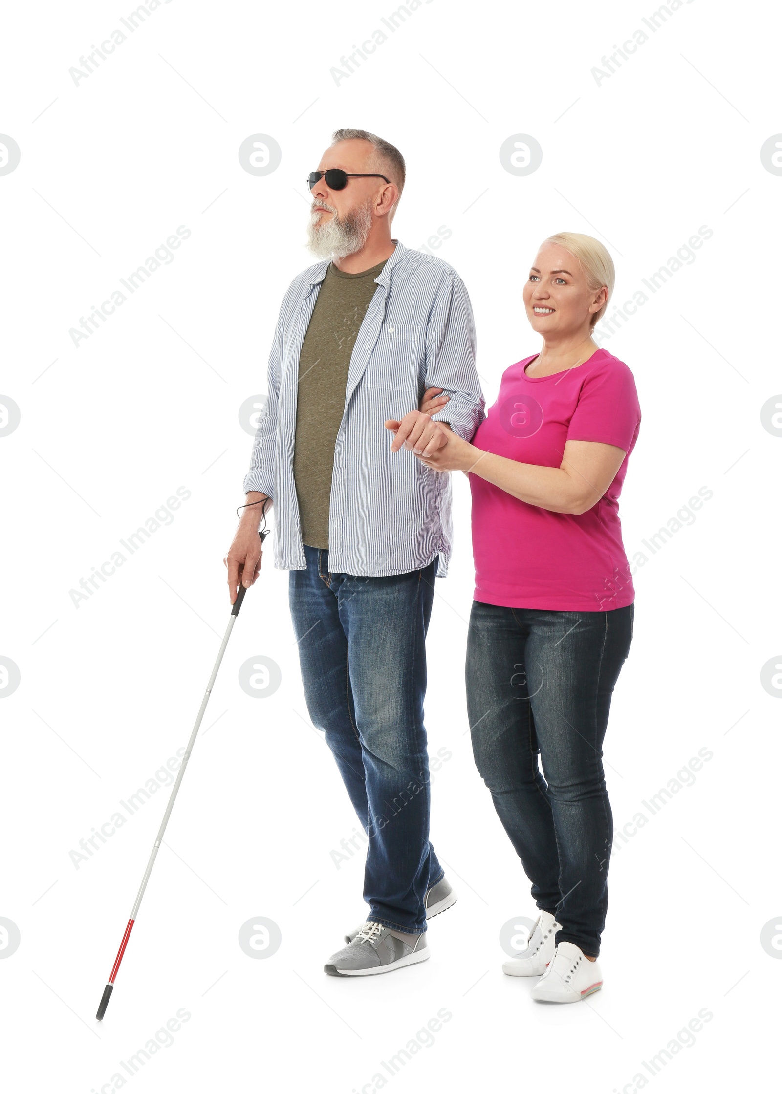 Photo of Mature woman helping blind person with long cane on white background