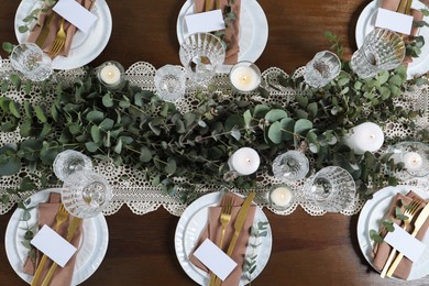 Luxury table setting with beautiful decor and blank cards, flat lay. Festive dinner