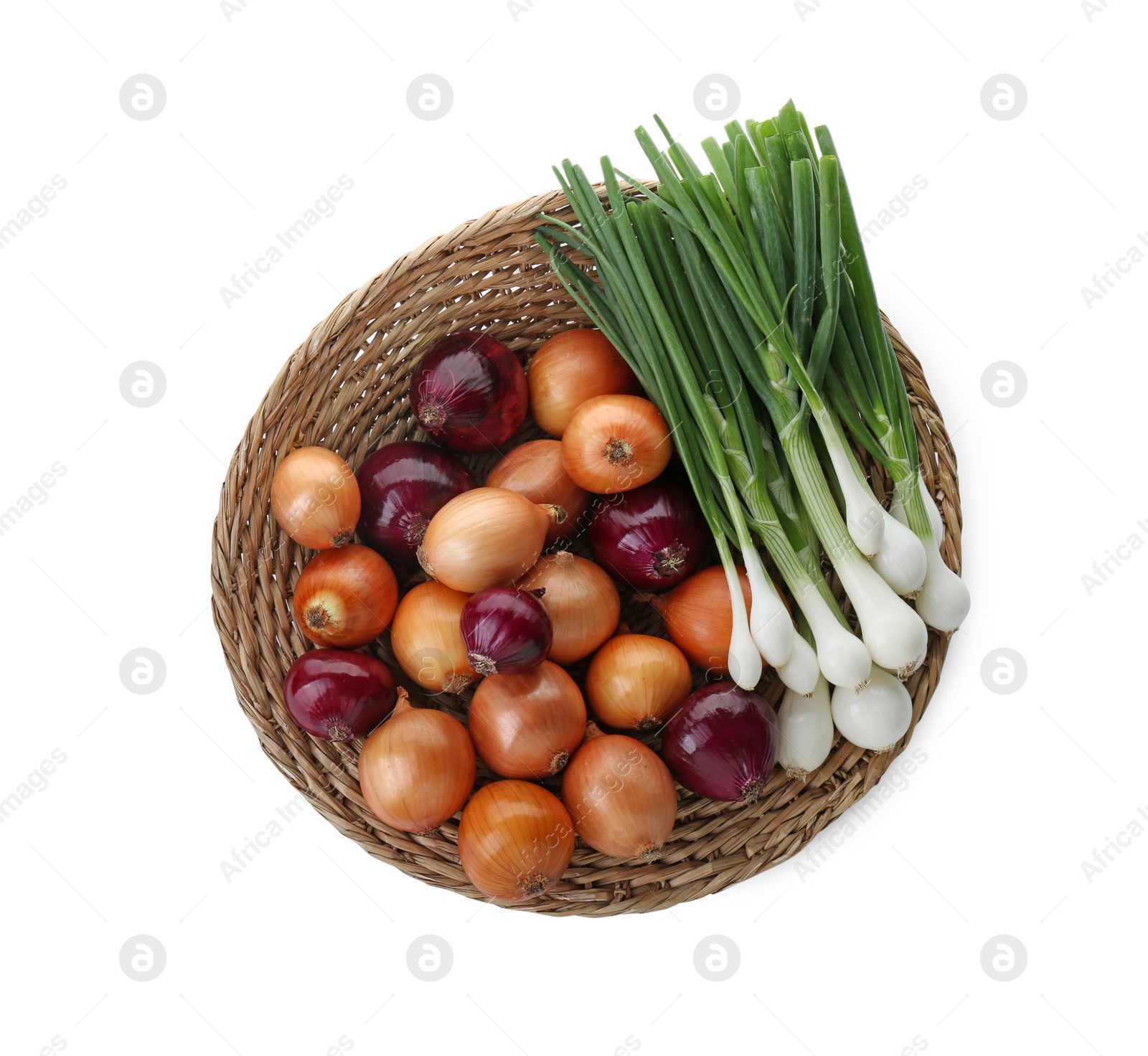 Photo of Wicker mat with different kinds of onions isolated on white, top view