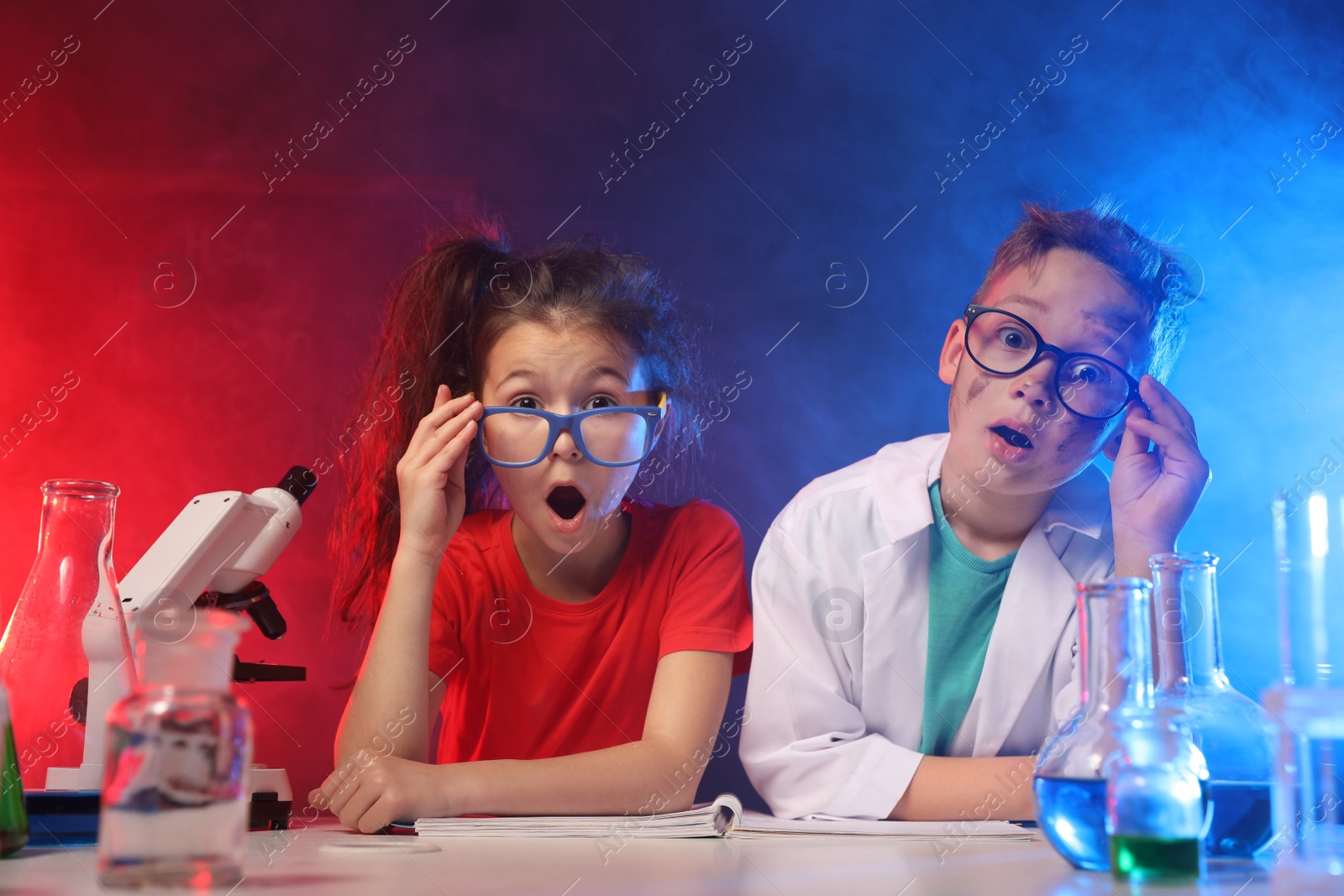 Photo of Emotional children in laboratory after explosion. Dangerous experiment