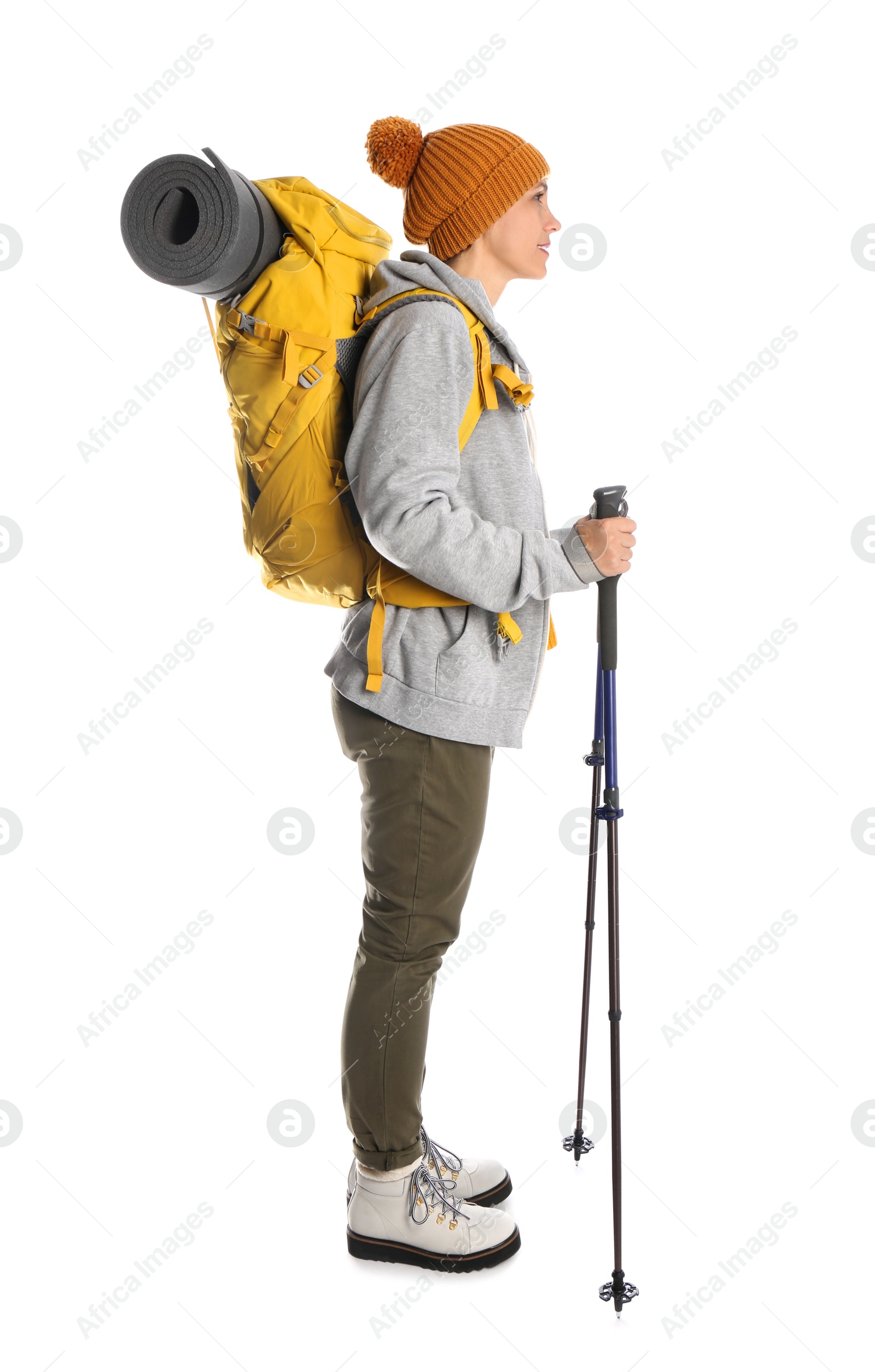 Photo of Female hiker with backpack and trekking poles on white background