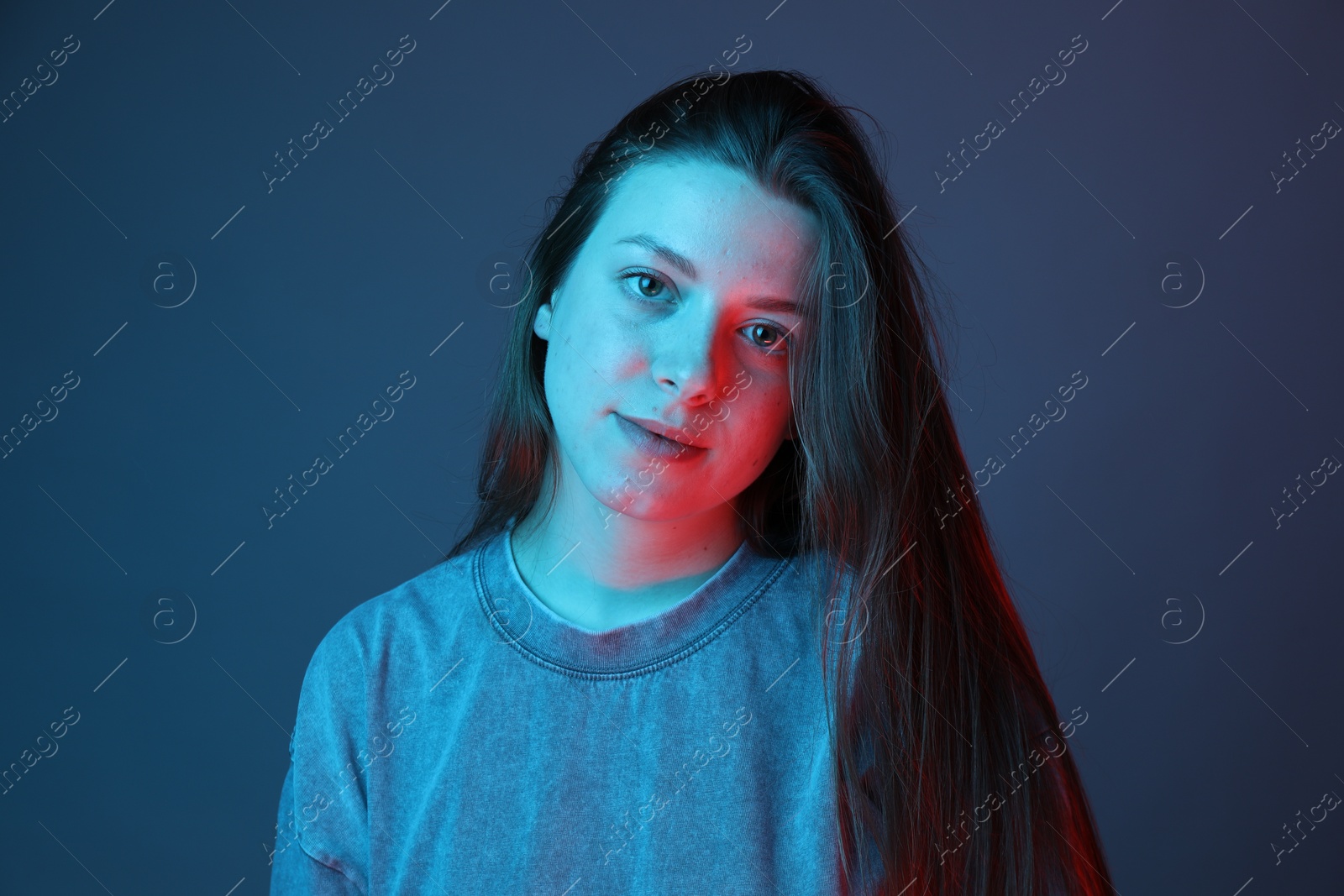 Photo of Portrait of beautiful young woman on color background