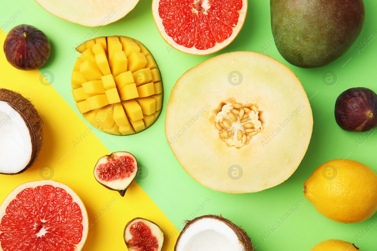 Photo of Flat lay composition with melon and other fruits on color background