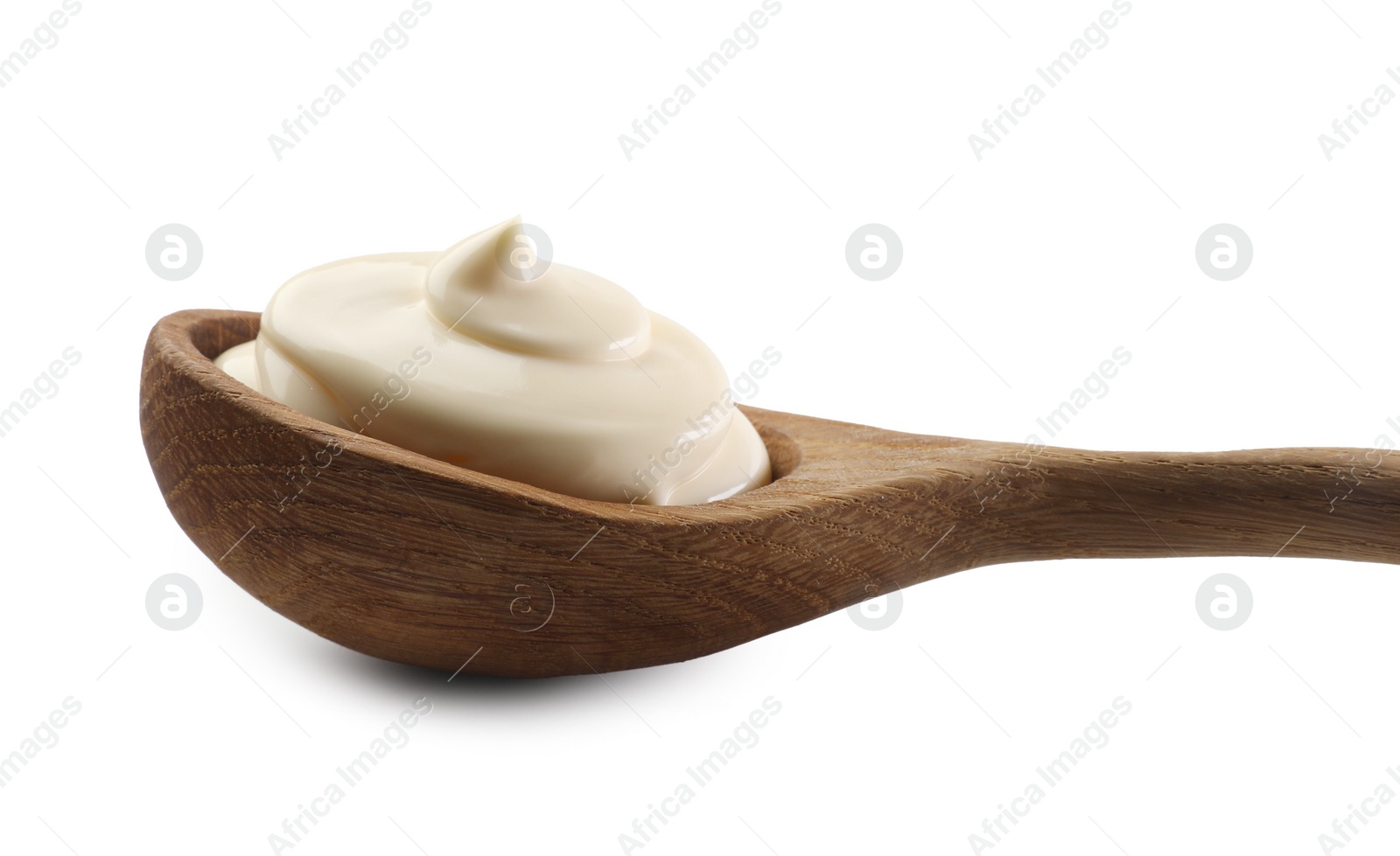 Photo of Natural yogurt in wooden spoon isolated on white