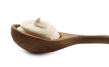 Photo of Natural yogurt in wooden spoon isolated on white