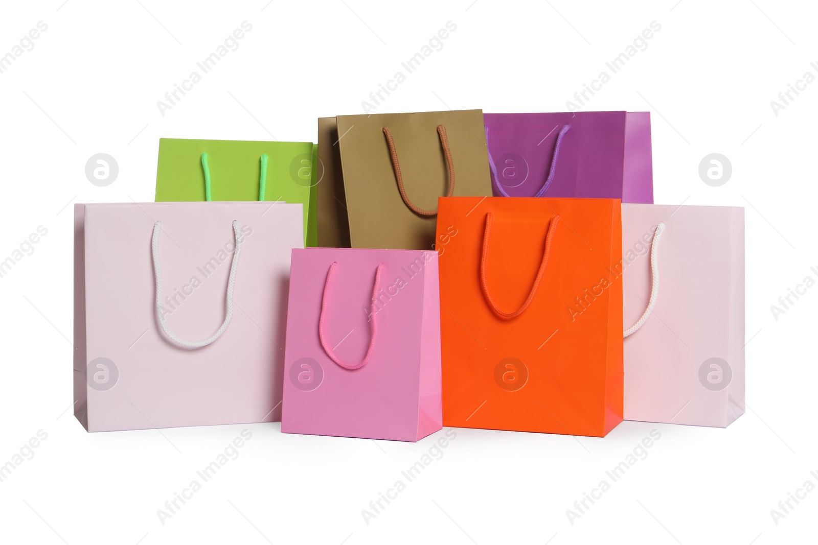 Photo of Colorful paper shopping bags isolated on white